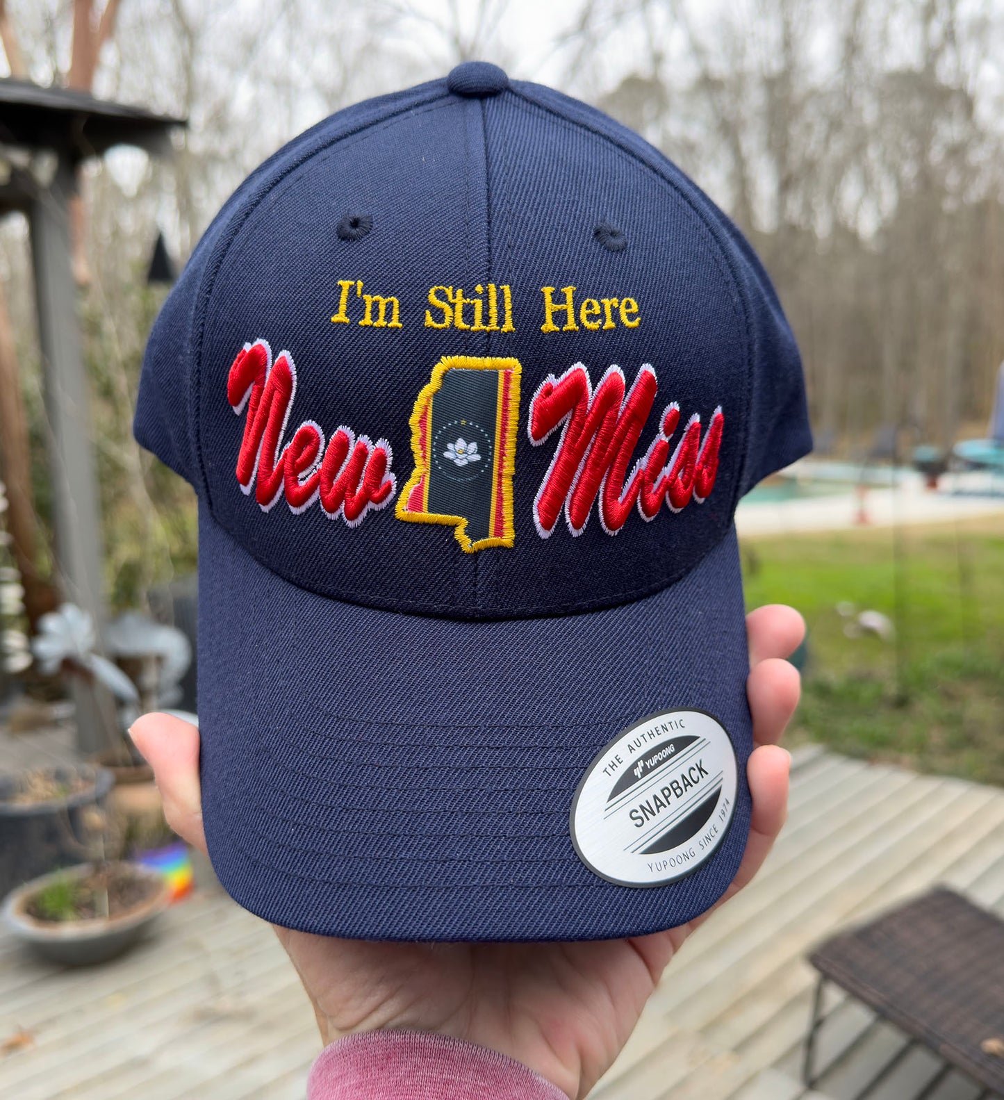 **New** " I'm Still Here" -Limited Edition Navy Curved brim STRUCTURED Hat featuring New Miss logo and Flag cutout