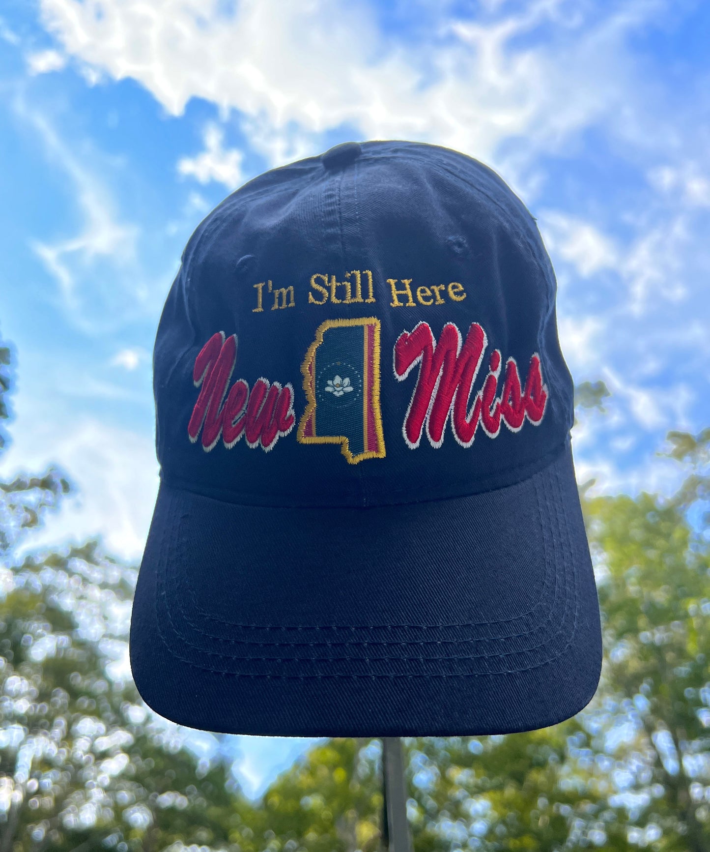 **New** " I'm Still Here"  -Limited Edition Navy Curved brim unstructured Hat featuring New Miss logo and Flag cutout