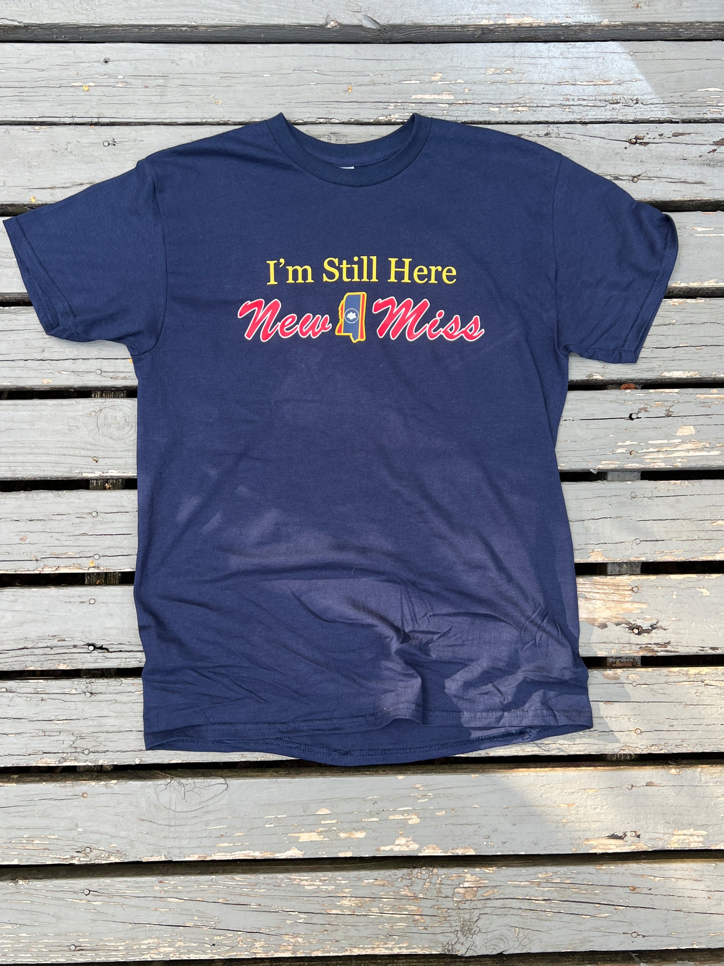 Limited Edition short sleeve Navy T-shirt  featuring " I'm Still Here"   with New Miss and State cutout.