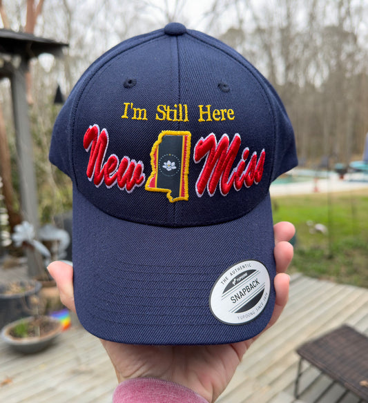 **New** " I'm Still Here"  -Limited Edition Navy Curved brim STRUCTURED Hat featuring New Miss logo and Flag cutout