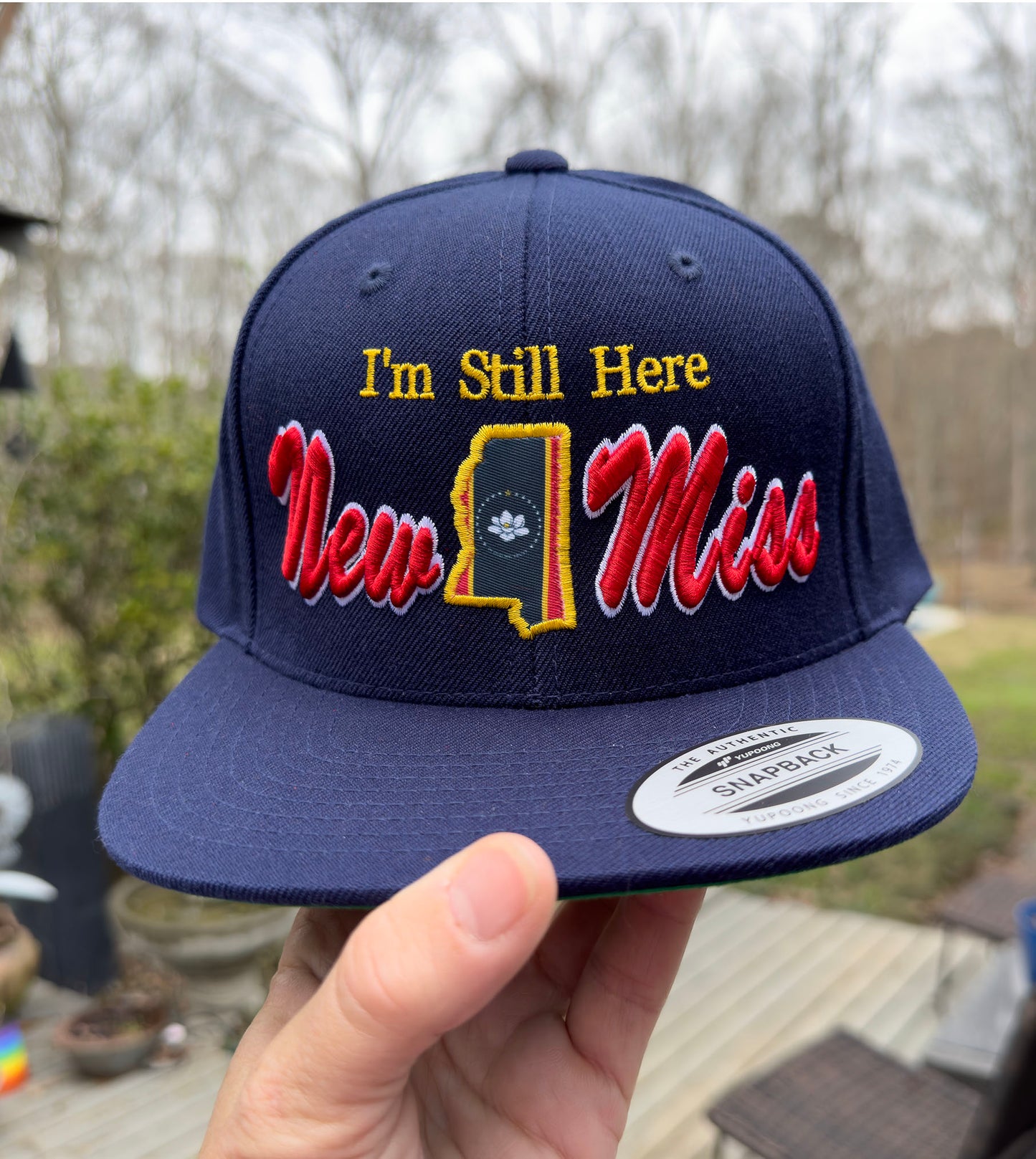 **New** " I'm Still Here"  -Limited Edition Navy FLAT BRIM STRUCTURED Hat featuring New Miss logo and Flag cutout